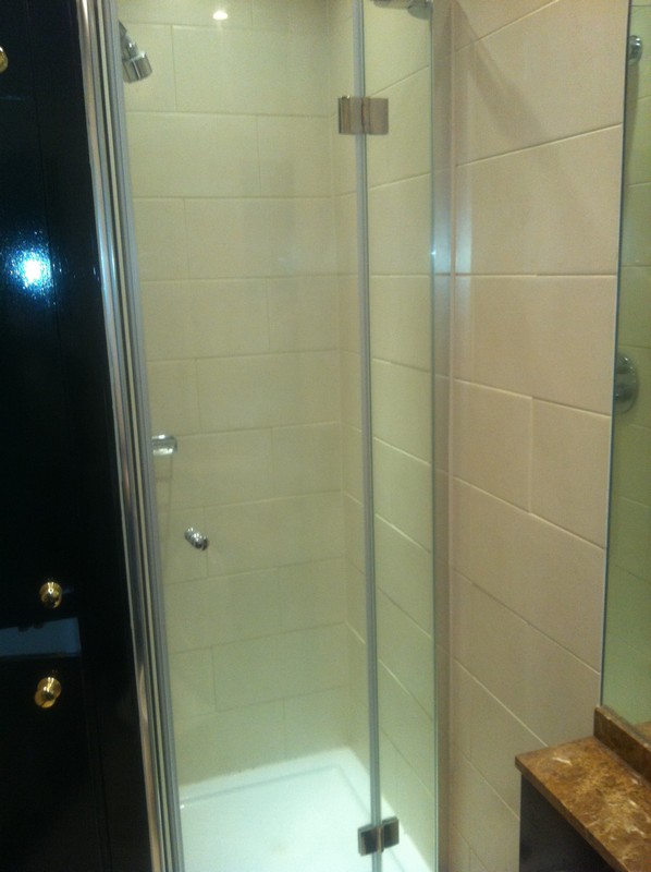 Frameless glass shower enclosure with chrome fittings in Chesham