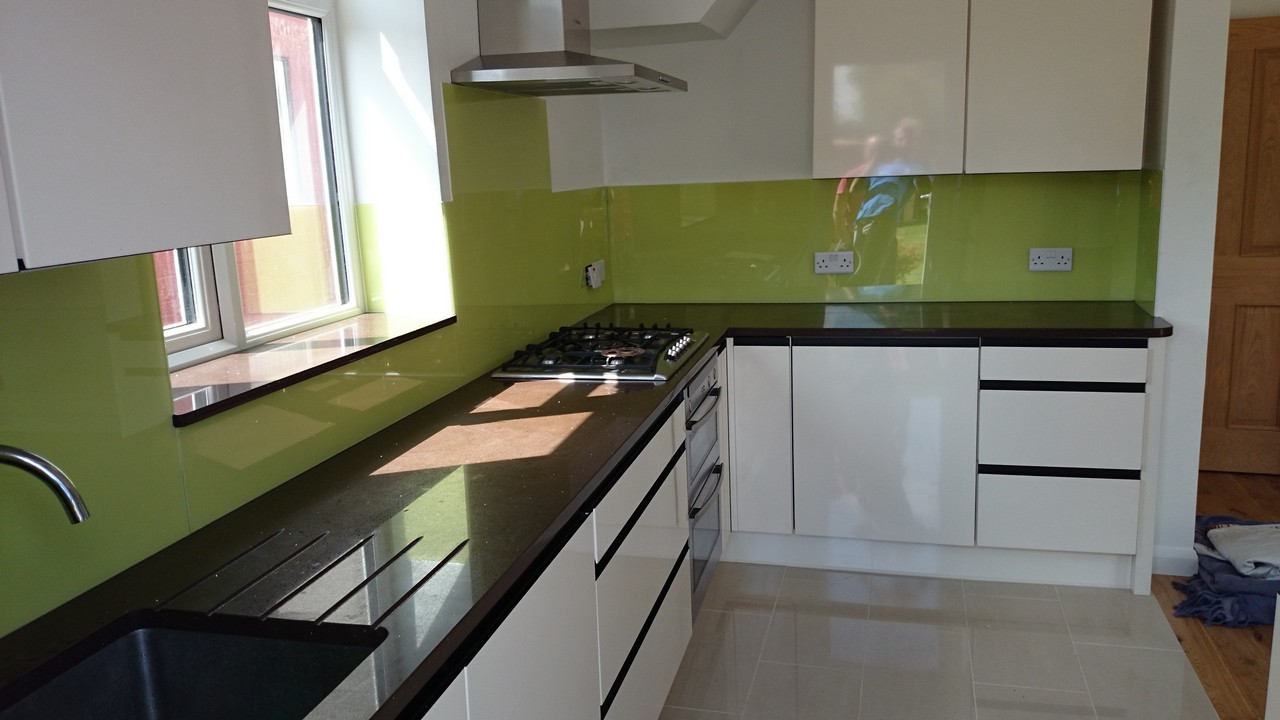 Lime green glass kitchen splashback installed by Chesham glaziers