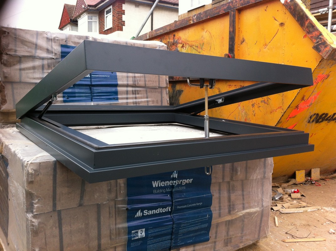 Opening flat roof skylight in anthracite grey installed in Chesham