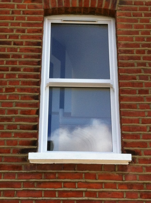 uPVC sash window on Victorian red brick house in Chesham